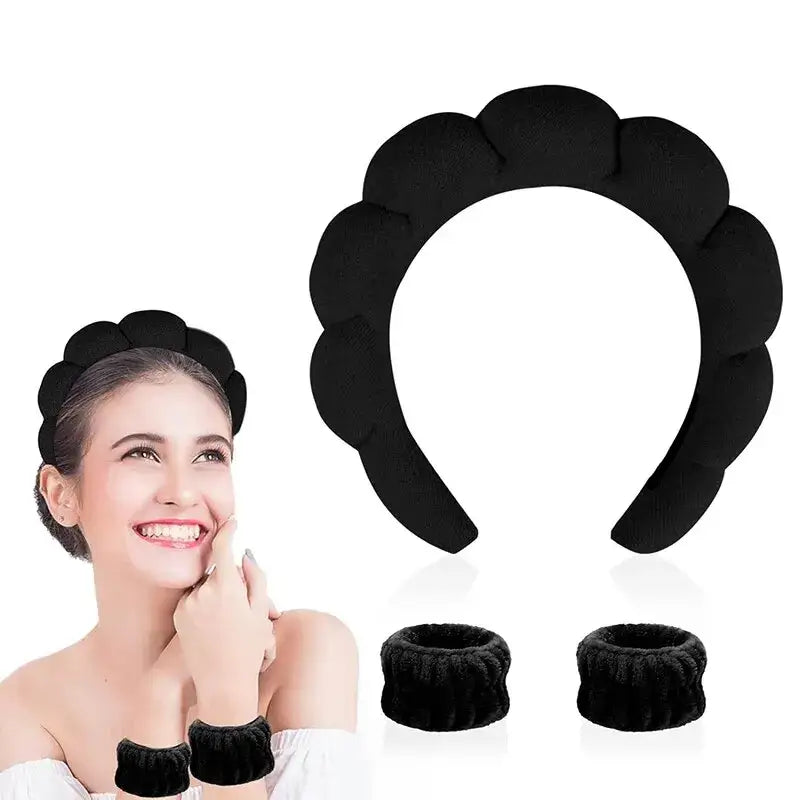 Black flower-shaped headband with matching wrist cuffs.