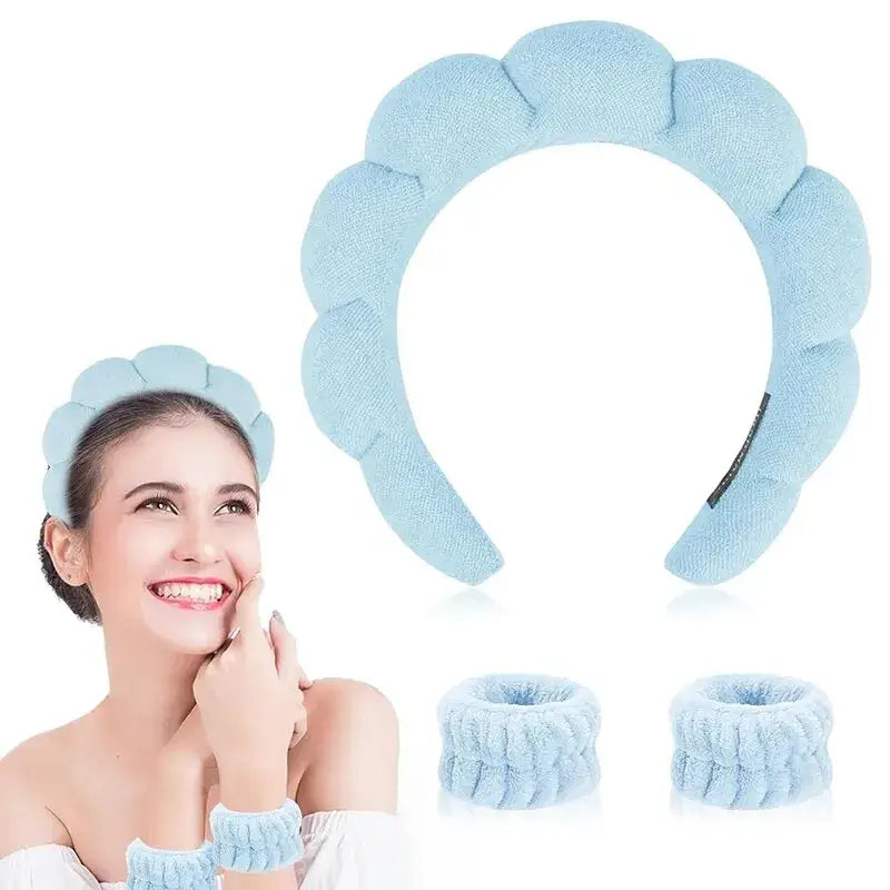 Pale blue, puffy headband with matching wrist cuffs.