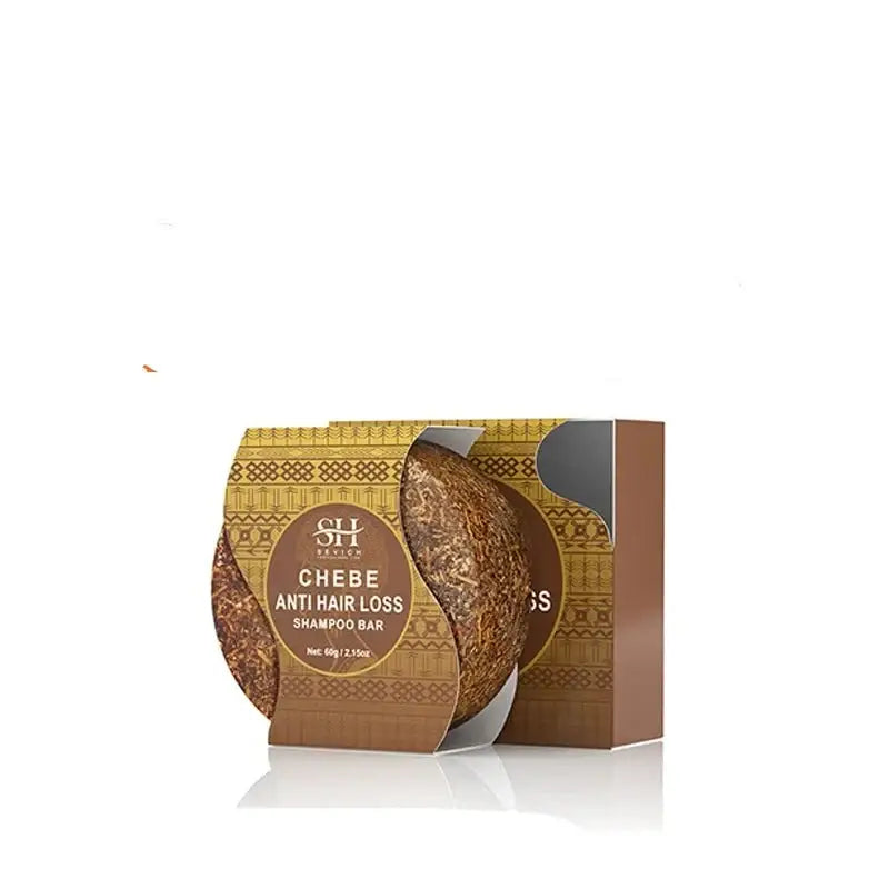 Packaged round bar of Chebe anti-hair loss shampoo with decorative gold patterns on its wrapper.