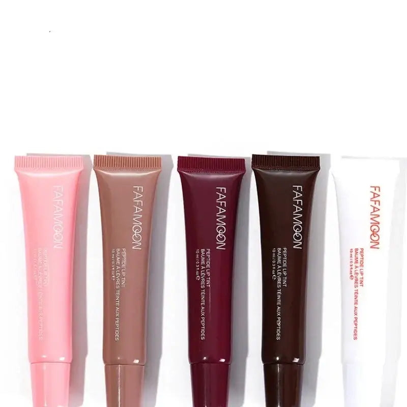 Five tubes of lip gloss or lip balm in various shades ranging from pink to brown and white.