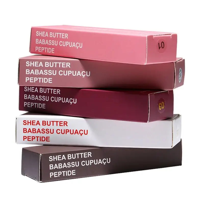 Stack of cosmetic product boxes labeled with ’Shea Butter Babassu Cupuacu Peptide’ in various colors.