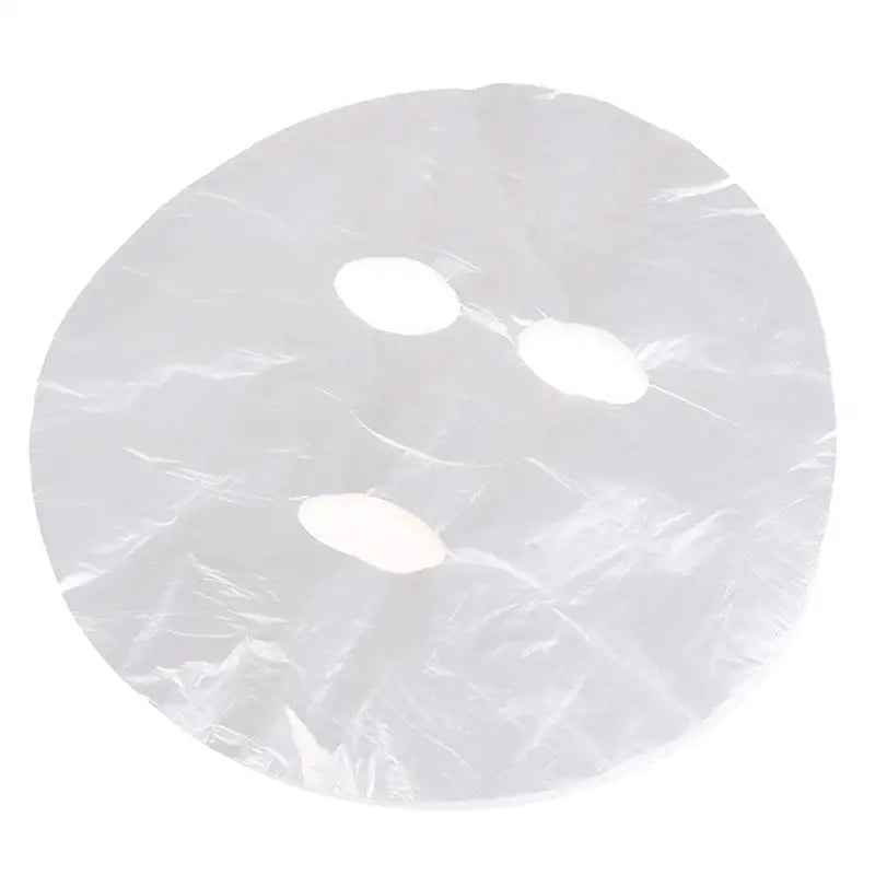 Sheet face mask with eye and mouth openings.