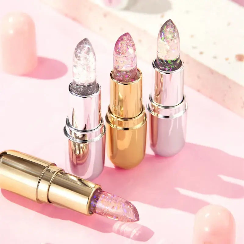 Crystal-tipped lipsticks in metallic tubes.