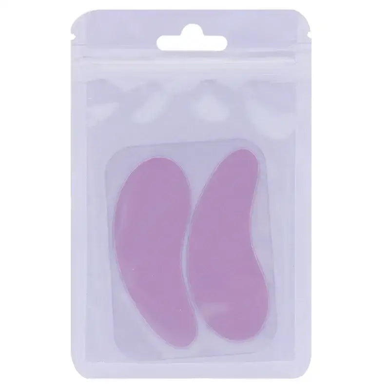 Pink, crescent-shaped gel pads in retail packaging.