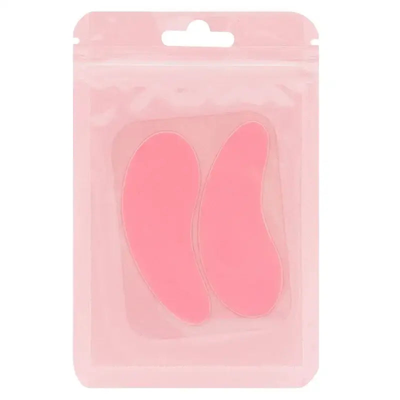 Pink, curved silicone patches in a plastic packaging.