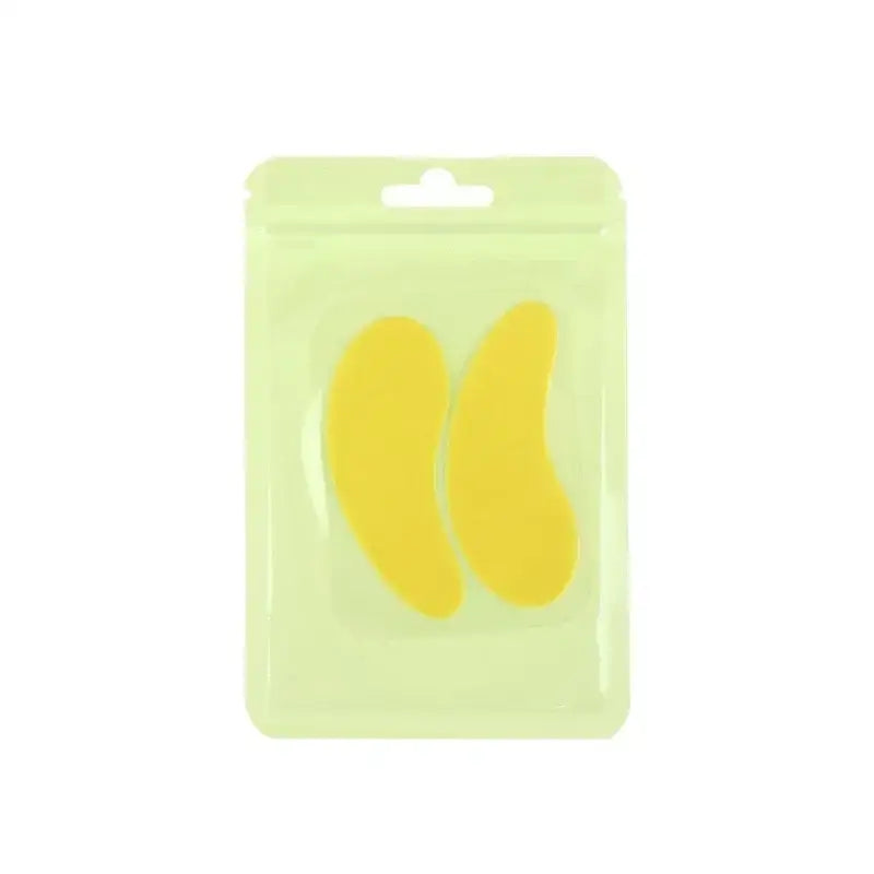 Two yellow, crescent-shaped objects in a clear plastic package.