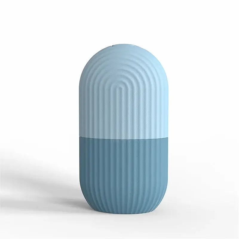 Capsule-shaped vase or container with ribbed texture in two-tone blue colors.