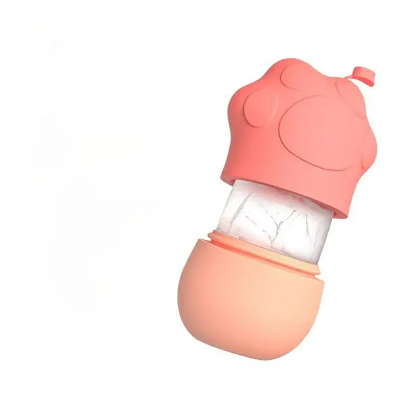 Pink silicone baby bottle with a mushroom-shaped cap.