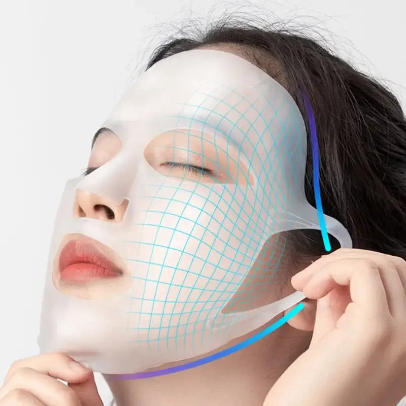 Facial mask with a glowing grid pattern being applied to a person’s face.