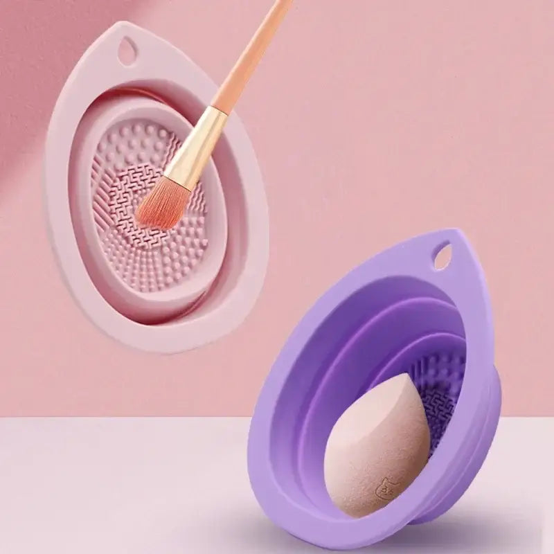 Silicone makeup brush cleaner pads in pink and purple colors.