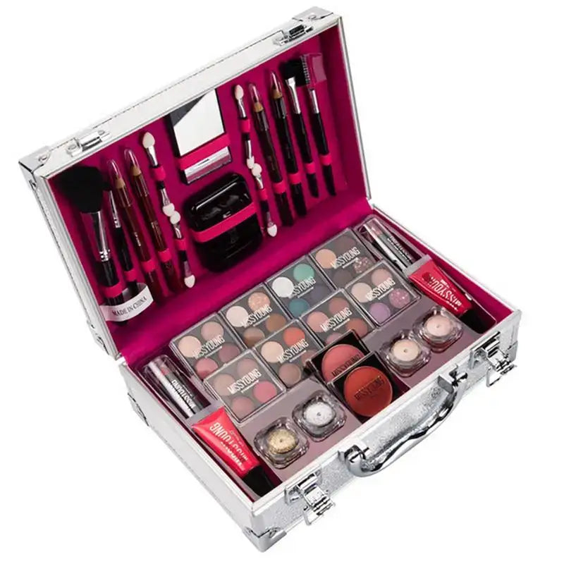 Makeup kit in a silver case with various cosmetic products and tools organized inside.