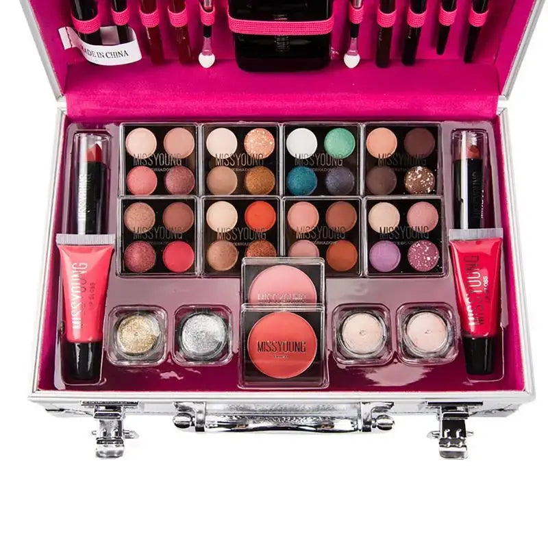 Makeup kit containing various cosmetic products in a pink case.