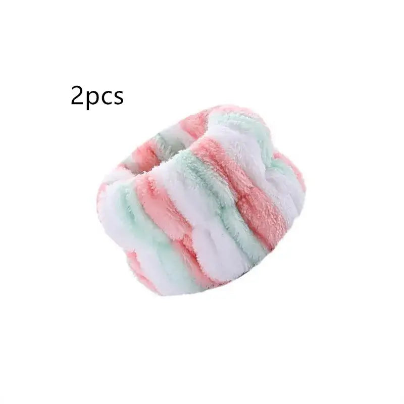 Fluffy, pastel-colored hair scrunchie or elastic hair tie in pink, white, and mint green stripes.