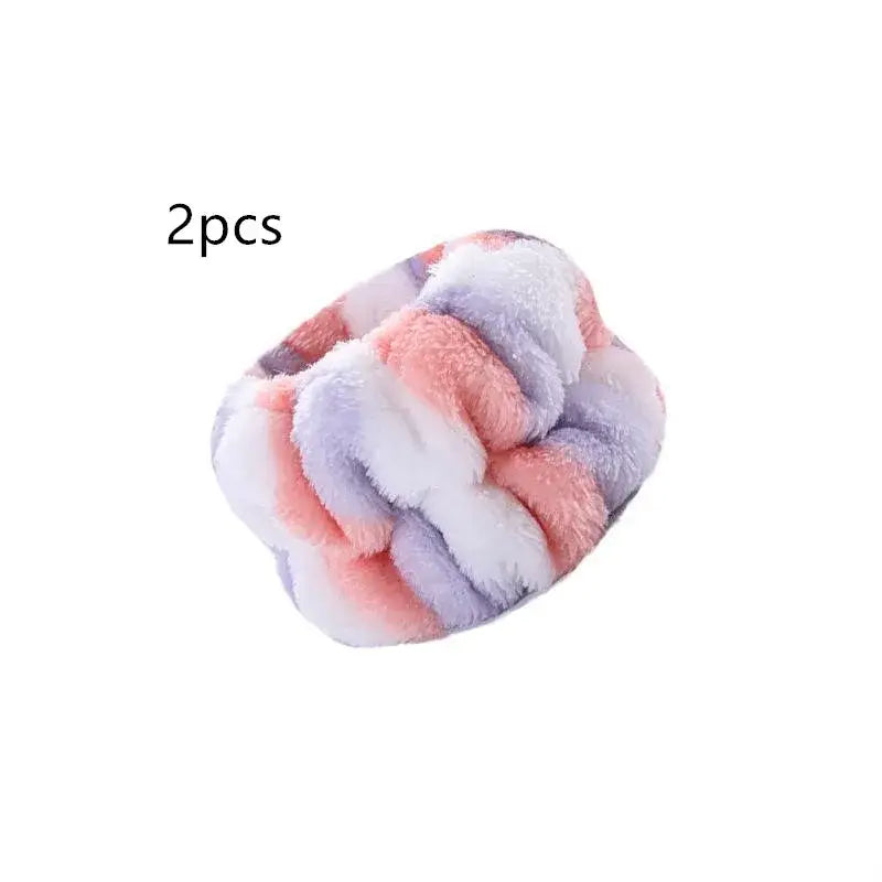 Fluffy, twisted hair scrunchie in pastel pink, white, and lavender colors.