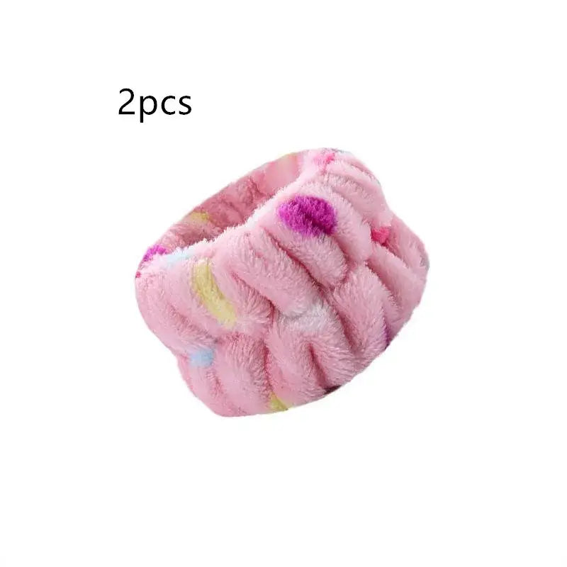 Pink fluffy scrunchie with colorful polka dot pattern.