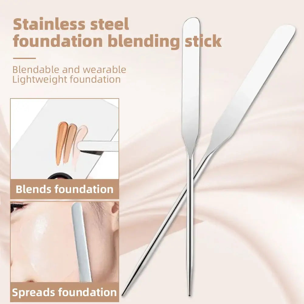 Stainless steel foundation blending stick with a flattened, curved tip.