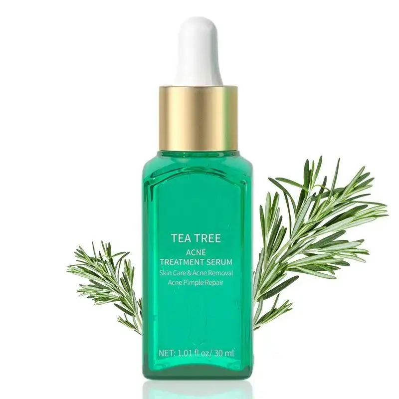 Green glass bottle of tea tree treatment serum with a gold cap and dropper.