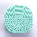 Teal Heart-Shaped Silicone Makeup Brush Cleaning Pad - Vignette | VogueBeautify