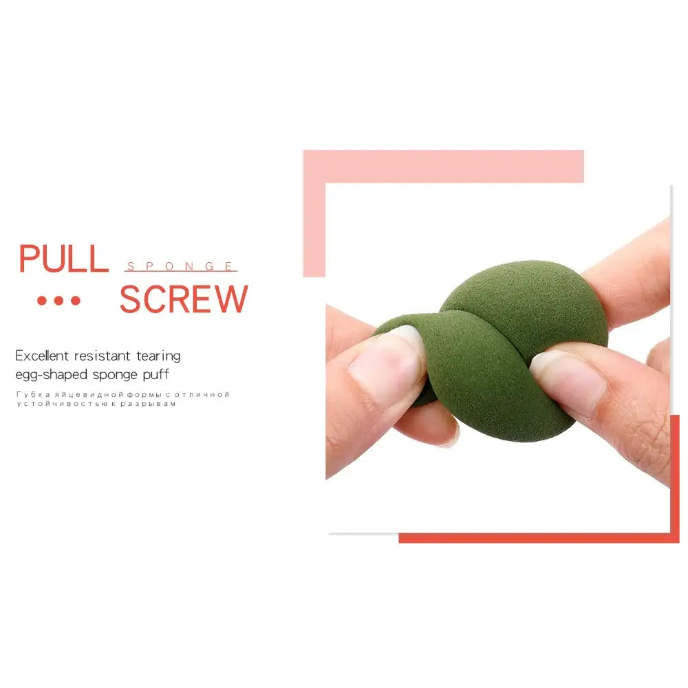 Green egg-shaped sponge or stress ball being squeezed between fingers.