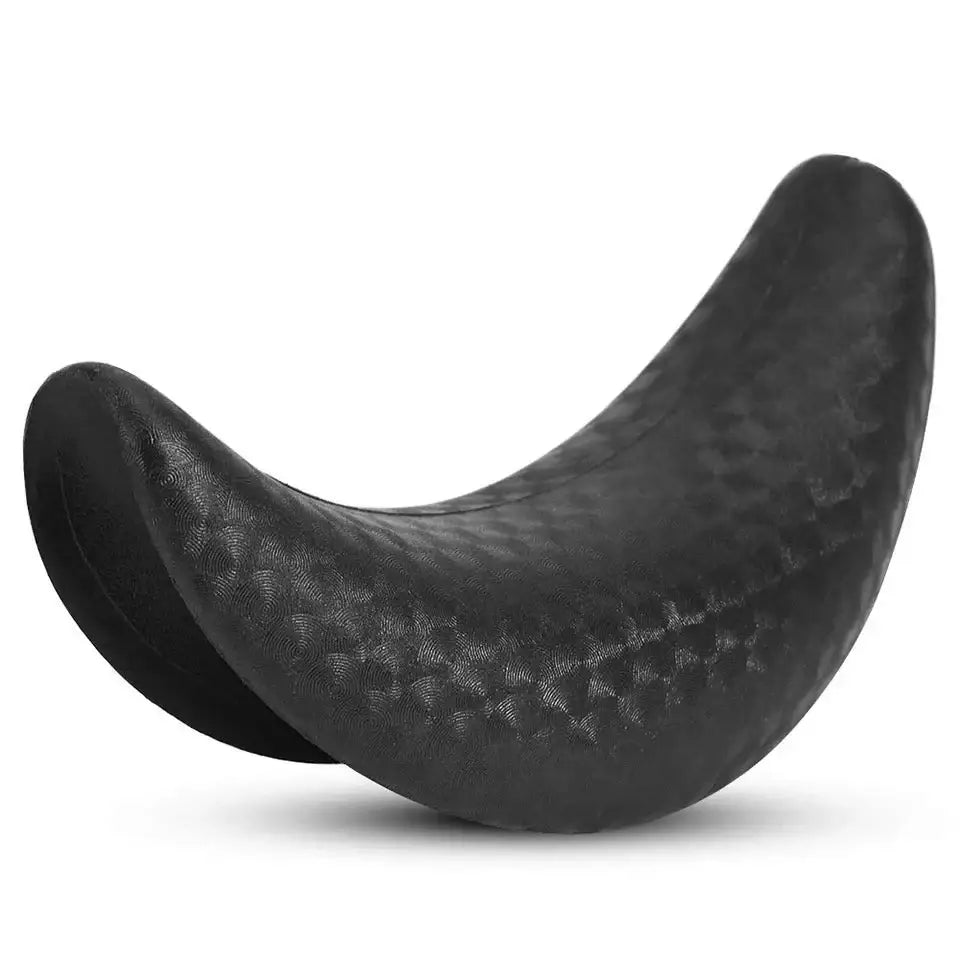 Curved, black, textured object resembling a crescent or banana shape.