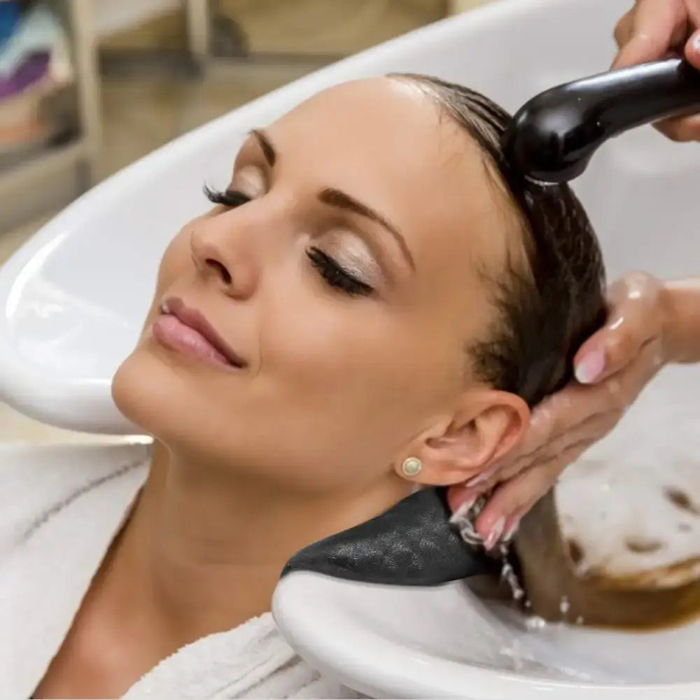 Woman having her hair washed at a salon.