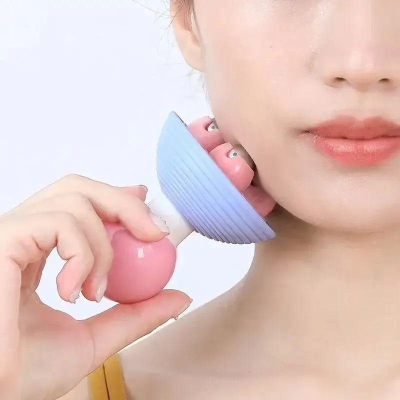 Handheld facial massage tool with a blue curved head and pink spherical handle.