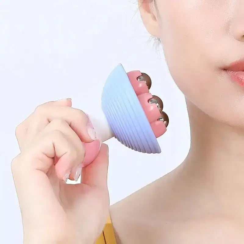 Handheld facial massage tool with three rotating balls.