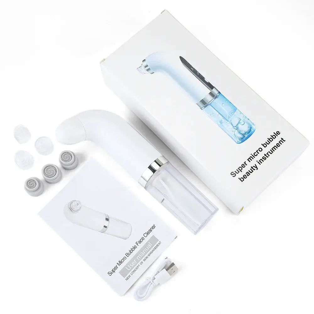 Handheld microneedling device with interchangeable heads and packaging.