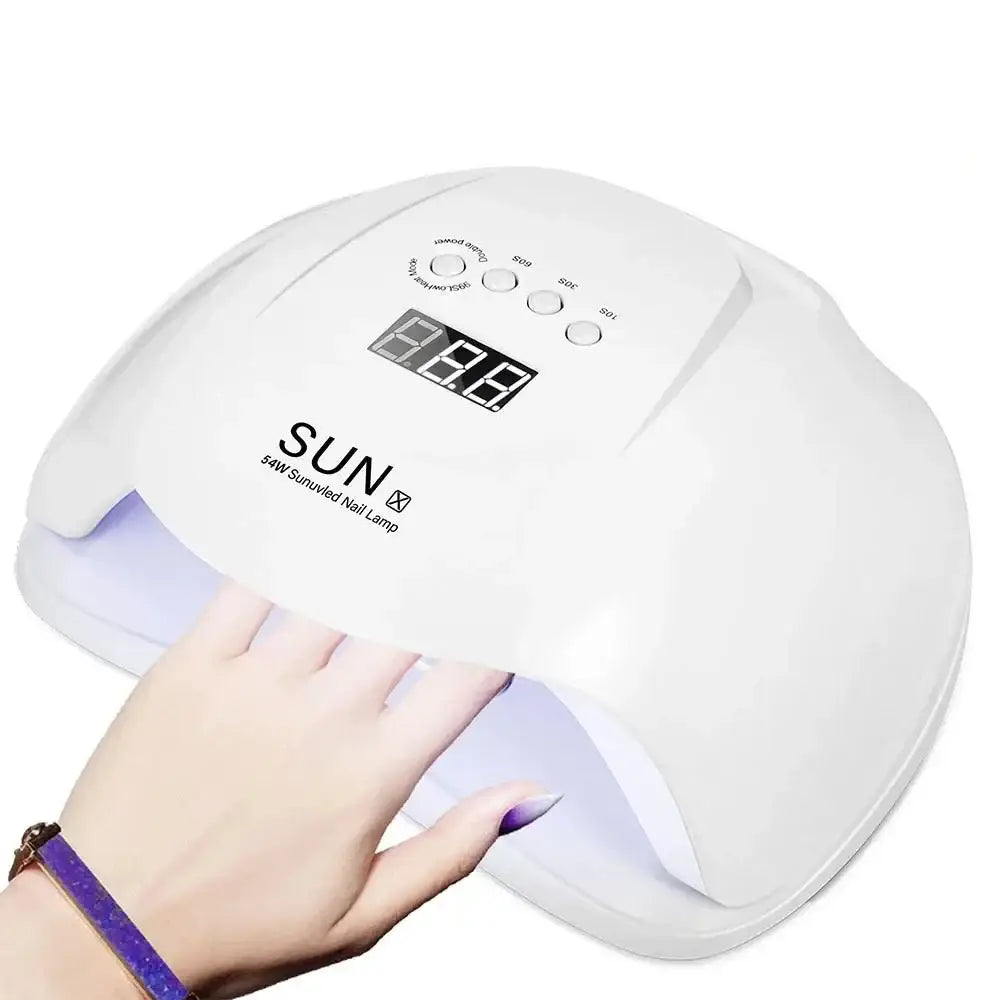 UV nail lamp for curing gel polish, with a digital display and a hand inserting underneath.