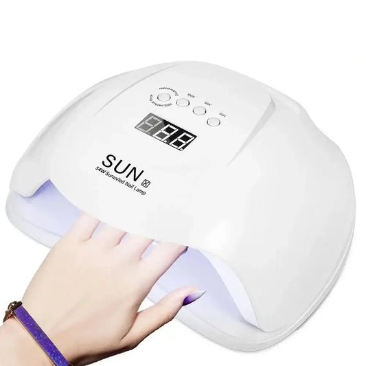 UV nail lamp for curing gel polish, with a digital display and a hand inserting underneath.