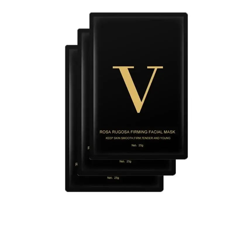 Black facial mask packets with a gold ’V’ logo prominently displayed.