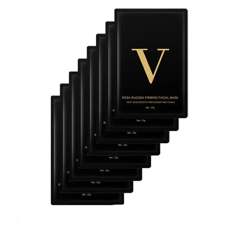 Stack of black facial mask packets with a gold ’V’ logo.