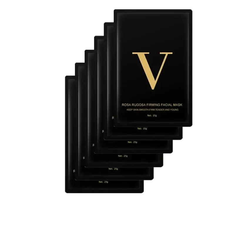 Stack of black facial mask packets with a gold ’V’ logo.