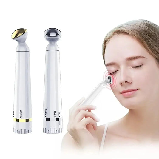 Handheld electronic eye massage device with two interchangeable heads.