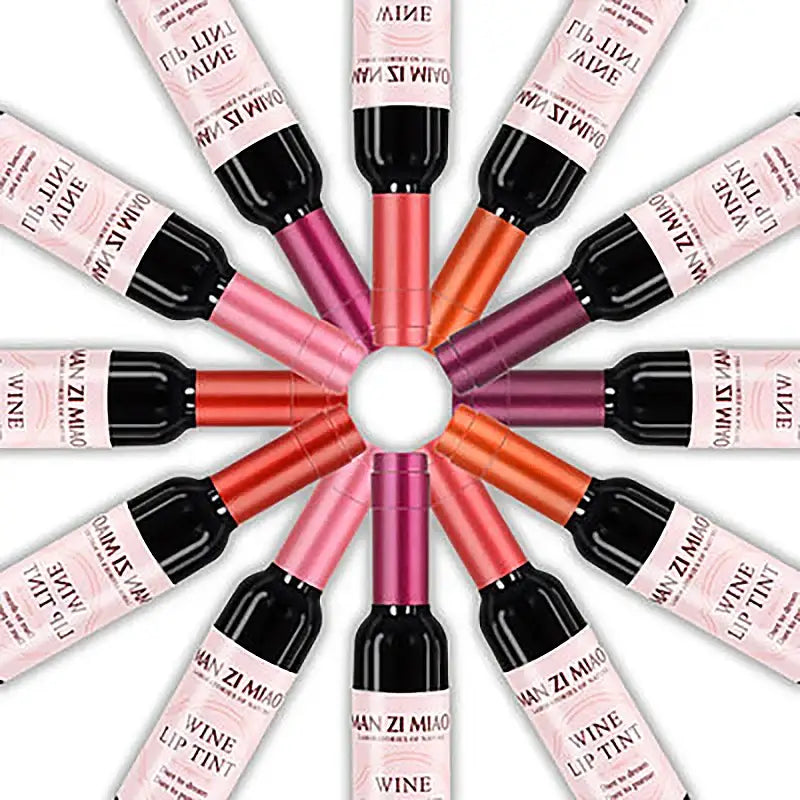 Circular arrangement of colorful lip gloss or liquid lipstick tubes.