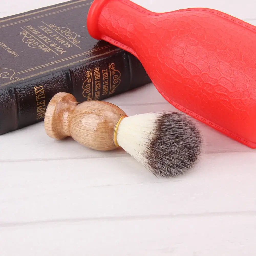 Shaving brush with a wooden handle and bristles.