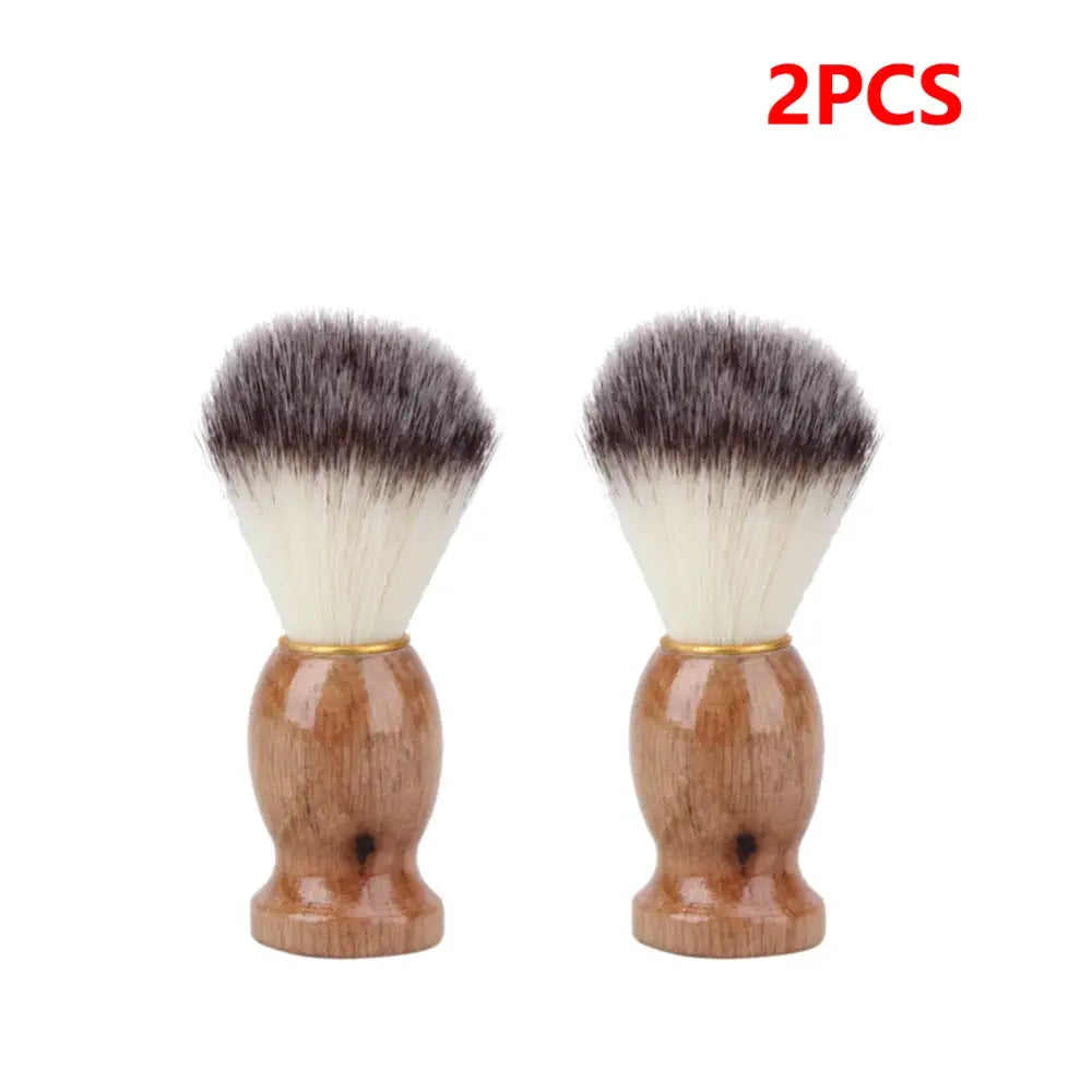 Two shaving brushes with wooden handles and soft, two-toned bristles.