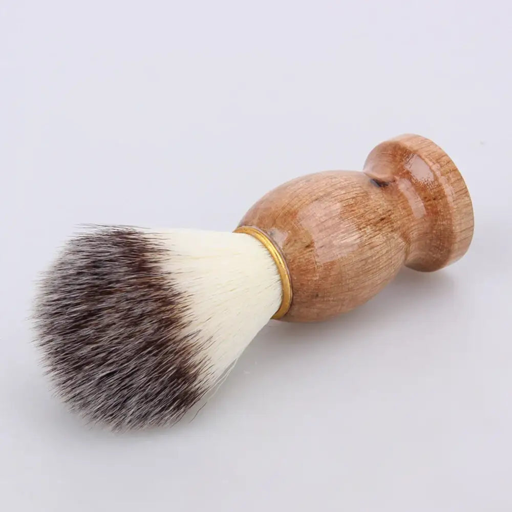 Wooden-handled shaving brush with soft bristles.