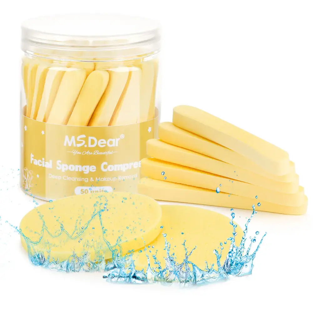 Clear plastic container filled with yellow facial sponges.